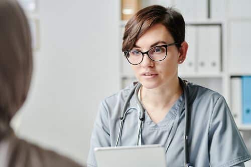 clinician talking to a patient